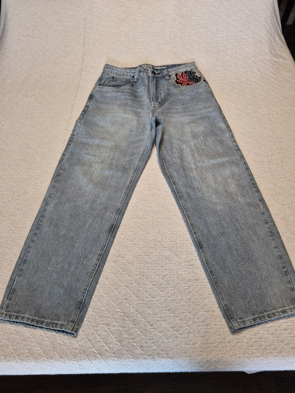 Light Blue Wash Loose Fit Men's Jeans with Embroidered Back Pockets
